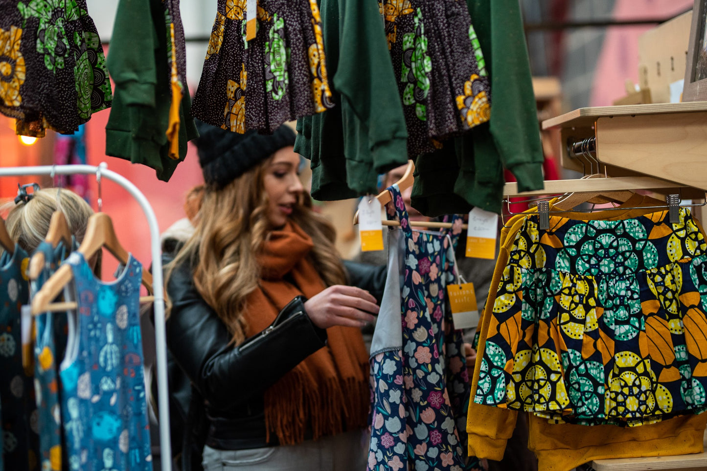 women looking at apparel on the market