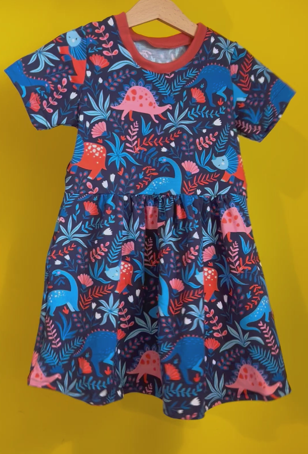 Load and play video in Gallery viewer, Blue Fauna Dinosaur Short Sleeve Baby & Toddler Jersey Dress