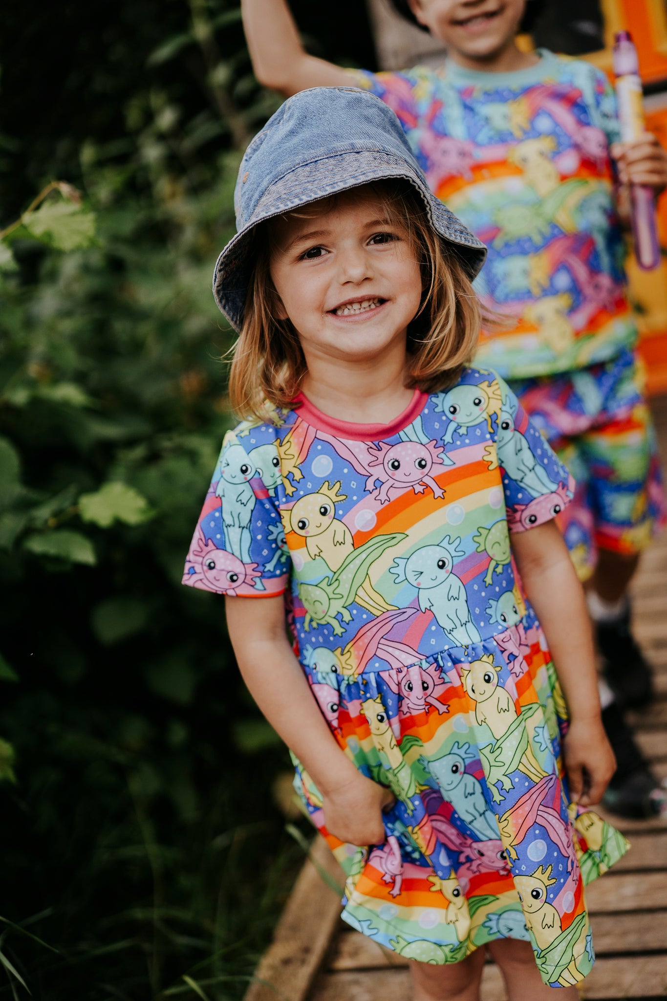 **Pre Order - back in stock mid June** 
Axelotl Rainbow Short Sleeve Baby & Toddler Jersey Dress