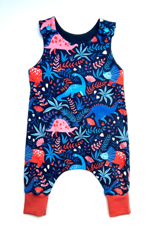 Beautifully soft baby and toddler handmade jersey romper in blue and red dinosaur print. Handmade to order in Sheffield, UK